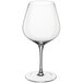 A close-up of a clear Della Luce Maia Burgundy Wine Glass with a stem.