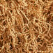 A close-up of a pile of brown Spring-Fill Kraft Crinkle Cut Paper Shred.