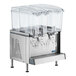 A Crathco refrigerated beverage dispenser with three clear containers and polycarbonate lids.