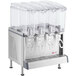 A Crathco refrigerated beverage dispenser with four clear containers and polycarbonate lids.
