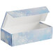 A blue 1 lb. candy box with snowflakes on it.