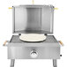 An Omcan stainless steel portable outdoor pizza oven grill with a pizza on it.