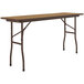 A Correll rectangular folding table with a medium oak wooden top and brown frame.