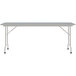 A rectangular gray granite Correll folding table with gray legs.