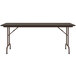 A Correll walnut folding table with a brown frame.