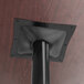 A black pole with a black stamped steel square on top.