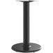 A Lancaster Table & Seating black metal bar height table base with a stamped steel column.