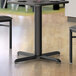 A Lancaster Table & Seating black standard height column table base.