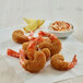Golden Dipt Gourmet Coating breaded fried shrimp with a bowl of sauce.