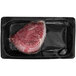 A piece of TenderBison bison tenderloin steak in plastic packaging.