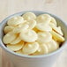 A bowl of Regal Foods White Chocolate Wafers.