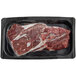 A piece of raw TenderBison sirloin steak in a black plastic tray.