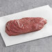 A TenderBison sirloin steak on white paper.