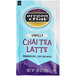 A blue box of Oregon Chai Vanilla Chai tea powder packets.