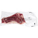 A TenderBison bone-in bison New York strip steak in a plastic bag.