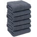 A stack of folded navy Monarch Brands hand towels.