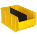 A yellow plastic Quantum storage bin with black dividers inside.