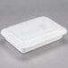 A white Pactiv rectangular plastic container with a clear plastic lid.
