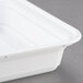 A close up of a Pactiv Newspring white plastic VERSAtainer with a lid.