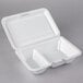 A Dart white foam takeout container with 2 compartments and a perforated hinged lid.