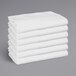 A stack of white Monarch Brands full size fitted sheets.