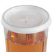 A translucent plastic Cambro lid with a straw slot on a clear plastic container.