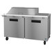 A Hoshizaki stainless steel refrigerator with a mega top salad prep table.