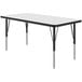 A Correll rectangular white activity table with black legs.