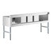 A white rectangular stainless steel Regency underbar sink with two large drainboards.