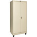 A tan metal storage cabinet with wheels.