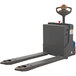 A Wesco Industrial Products heavy-duty power pallet truck with grey forks and a red handle.