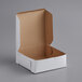 A white pie box with the lid open.