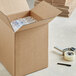 A Lavex kraft cardboard shipping box in a room.