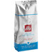 A white bag of illy Decaf Classico Coffee with a red logo.