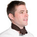 A man in a chef's uniform wearing a brown chef neckerchief.