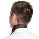 The back of a man wearing a brown Intedge chef neckerchief.
