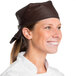 A smiling chef wearing a brown Intedge bandana.