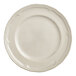 A white porcelain plate with a scalloped white rim.