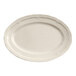 A warm gray oval porcelain platter with a scalloped edge.