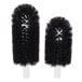 A close-up of a pair of black brushes with small black bristles.