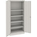 A light gray steel Tennsco storage cabinet with solid doors.