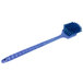 A Carlisle blue plastic pot scrub brush with a long blue handle and bristles on the end.