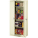 A white metal Tennsco storage cabinet with shelves full of items.