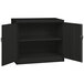 A black Tennsco jumbo storage cabinet with solid doors open.