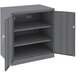 A dark gray Tennsco metal storage cabinet with solid doors open.