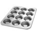 A Chicago Metallic MaryAnn specialty pan with six cupcake holes.