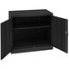 A black Tennsco metal storage cabinet with open solid doors.