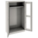 A light gray metal Tennsco wardrobe cabinet with open C-Thru doors.