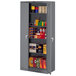 A dark gray metal Tennsco storage cabinet with shelves.