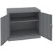 A dark grey Tennsco steel storage cabinet with open solid doors.